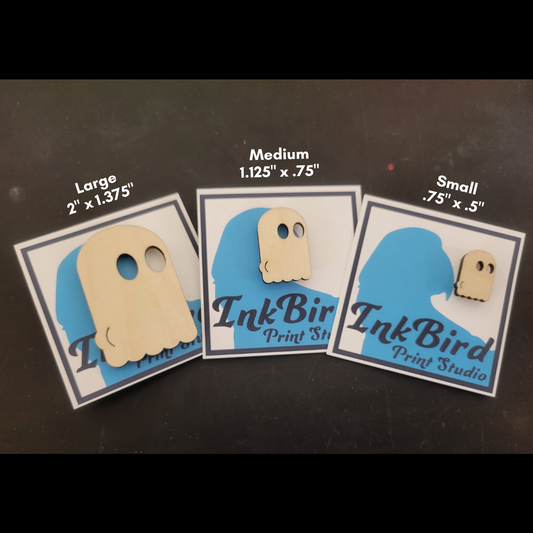 A laser cut wood pin/brooch, in three sizes (small/med/large), of a ghost with the outline of their butt-cheeks visible in their sheet.