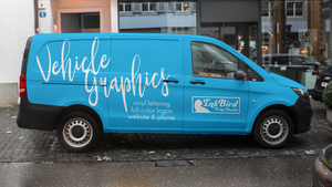 blue mini van with vinyl lettering and a logo applied to the outside. Custom Vehicle Graphics for vans, trucks, and trailers by InkBird Studio. DIY or we install!