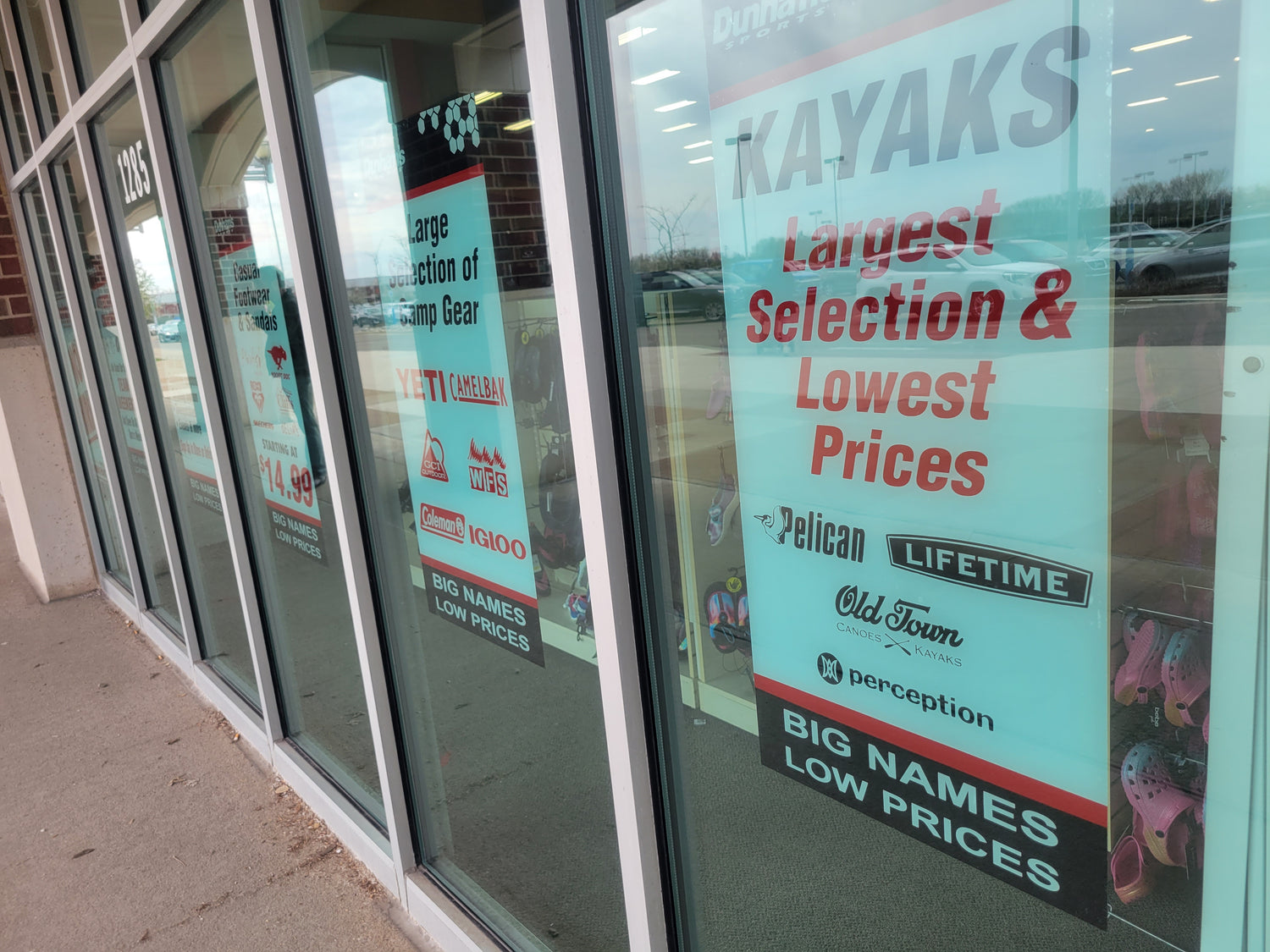 Photo of Dunham's Sports Storefront Signage, Static Cling, Screen Printed by InkBird Print Studio