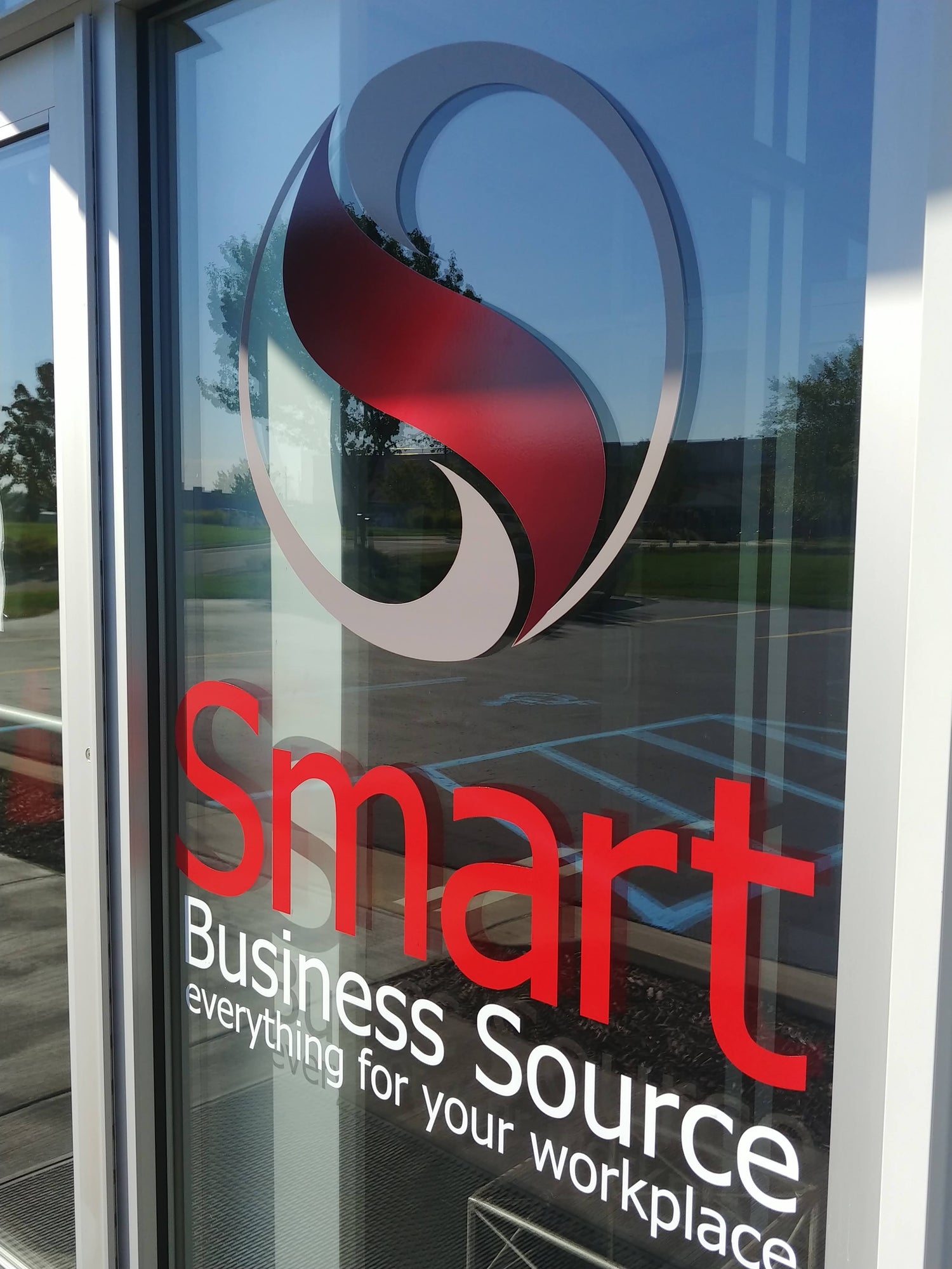 An office front window with a business logo and vinyl lettering. Applied by InkBird Print Studio